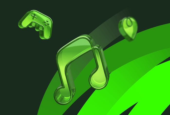 Photo of a dark-skinned happy young man in a yellow shirt walking down the street, holding the phone, talking to his girlfriend, and smiling, looking cheerful.